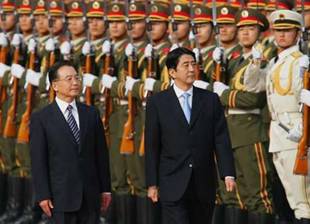 Chinese Premier Wen Jiaboa leads Japanese Prime Minister Shinzo Abe  past a guard of honour at the Great Hall of the People in Beijing.