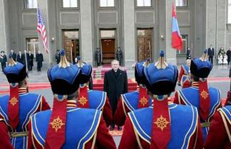 Meeting of warriors: President Bush stops to review troops of the Mongolian Honour Guard upon his arrival in the capital Ulan Bator.